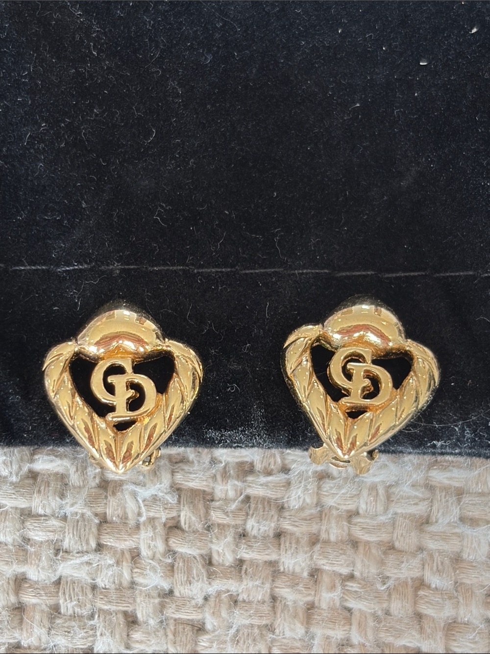 vintage Christian Dior gold-plated monogram "CD" braided heart clip-on earrings.